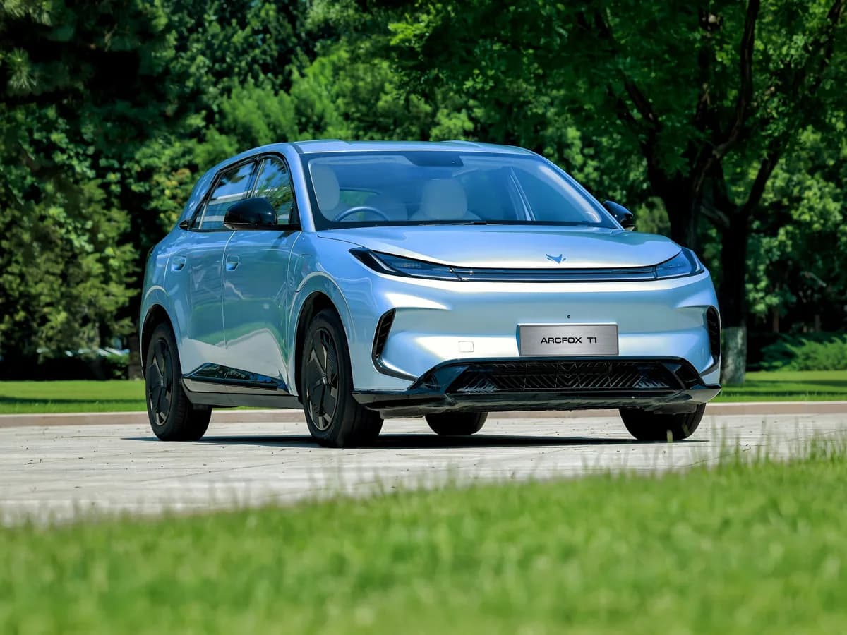 Silver ARCFOX T1, front three-quarter view in a park