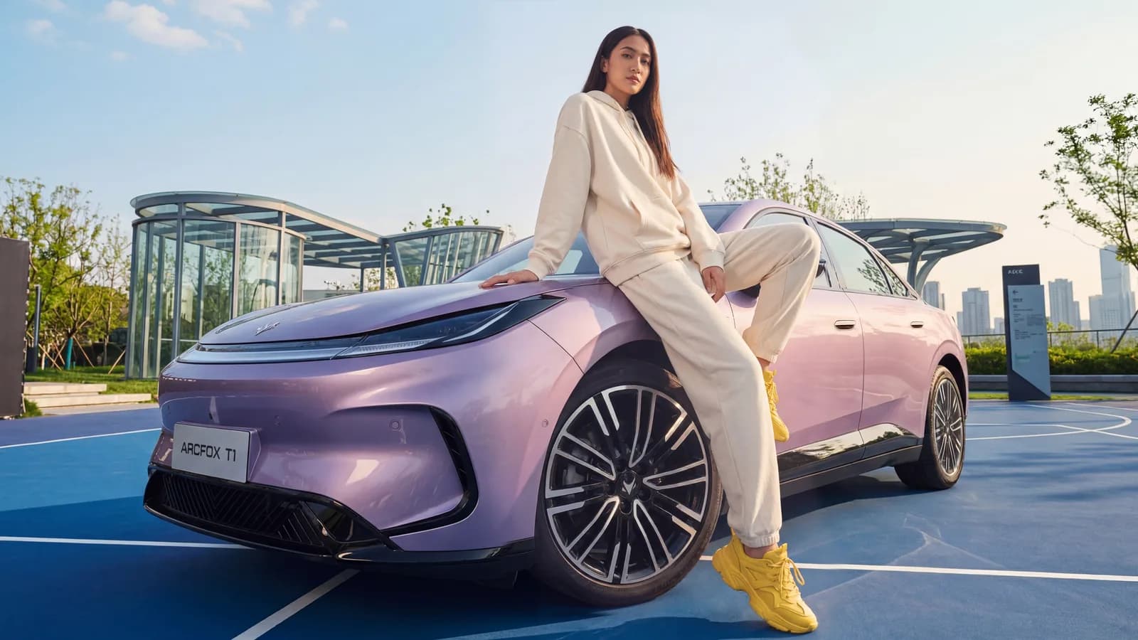 Twilight Purple ARCFOX T1 parked on a blue rooftop court in the city