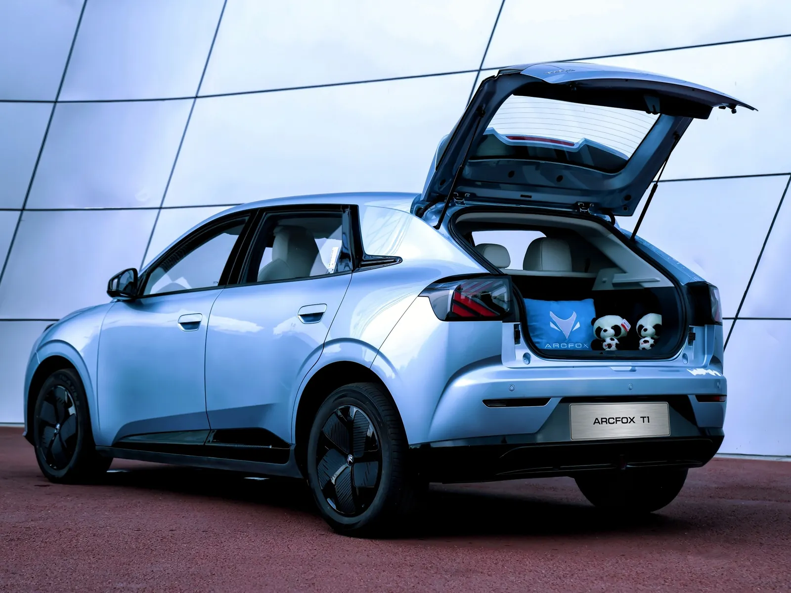 Silver ARCFOX T1 from the rear with the tailgate open, showing the boot