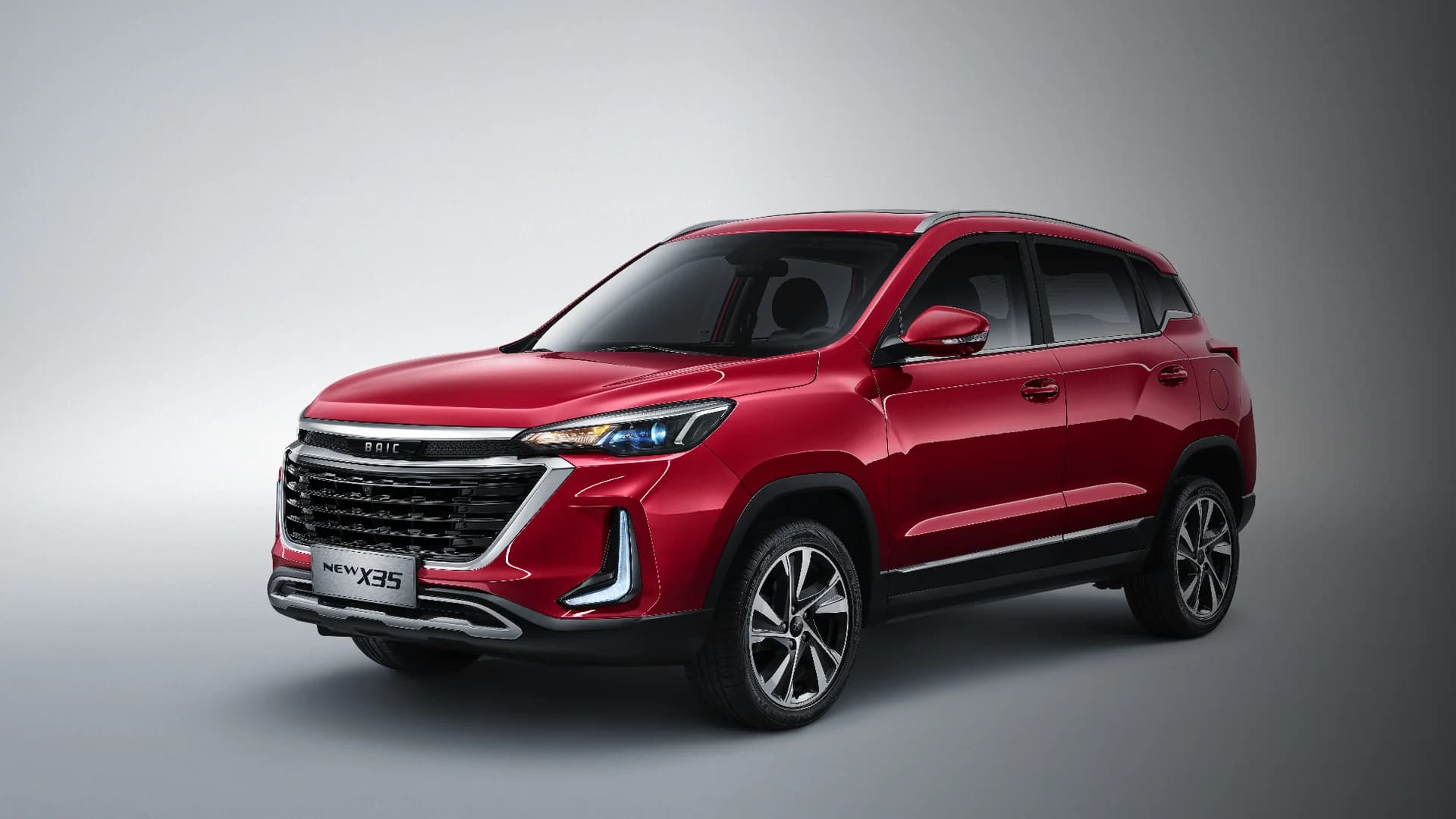 Red BAIC X35 front three-quarter view in the studio